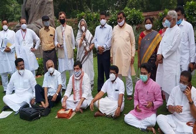 MPs protest in front of Gandhi statue in Parliament premises