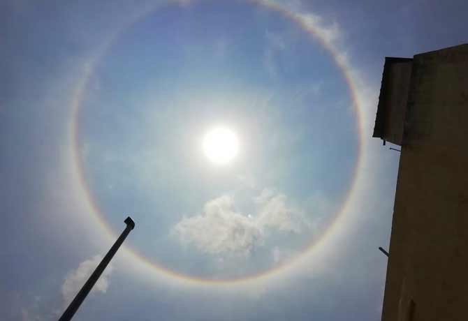 witness circular rainbow around sun in telangana