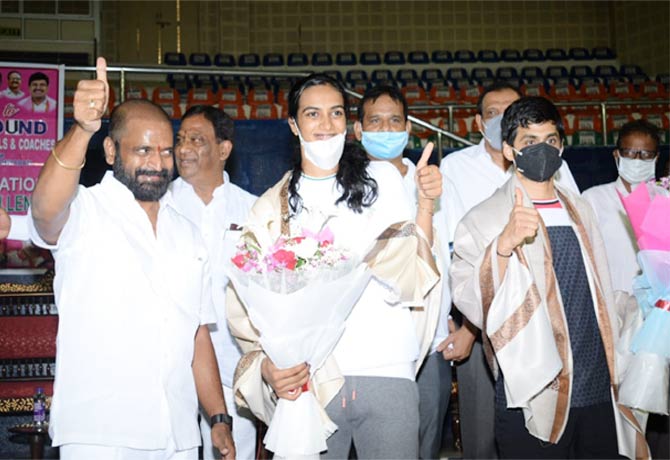 PV Sindhu and Sai Praneeth were honored by state Sports minister