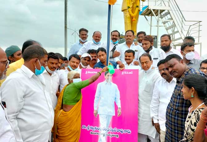Milk shower to CM KCR photo in Nirmal