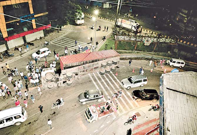 An overturned container at Lakdikapul