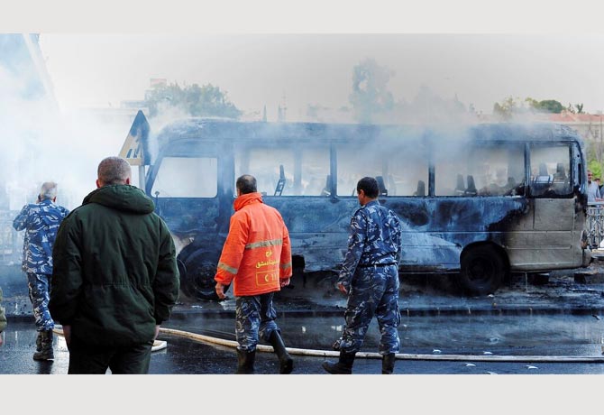 Bus bombs kill 14 in Syria