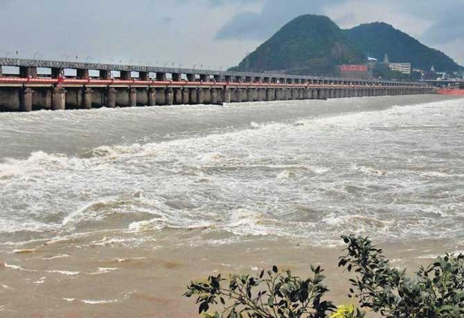 Woman jumping into Krishna river