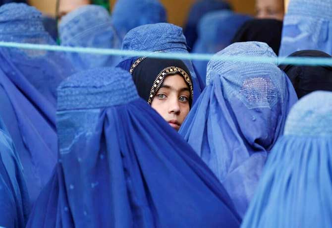 Taliban announce women must cover face