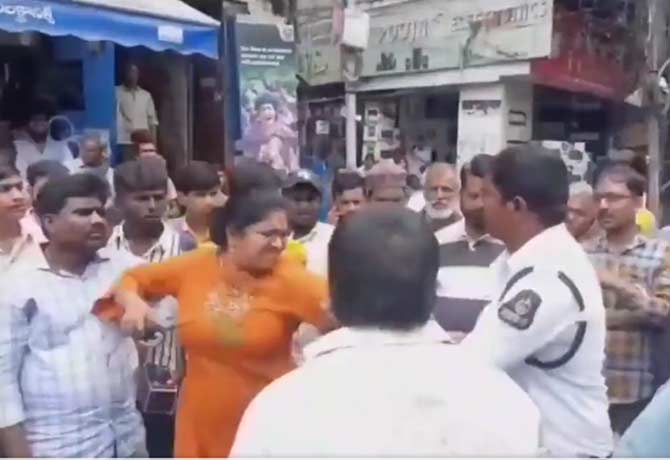 Woman creates ruckus after traffic police in sultan bazar