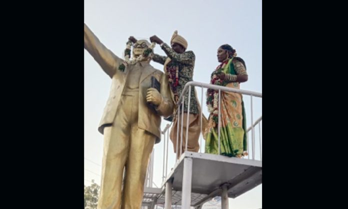 New Couple take blessings from Ambedkar Statue in Karimnagar