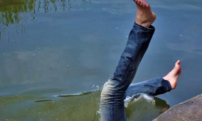 young man falling into Lakdaram pond