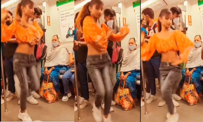 Young women dance in Metro train