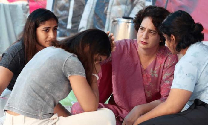 Priyanka Gandhi with wrestlers