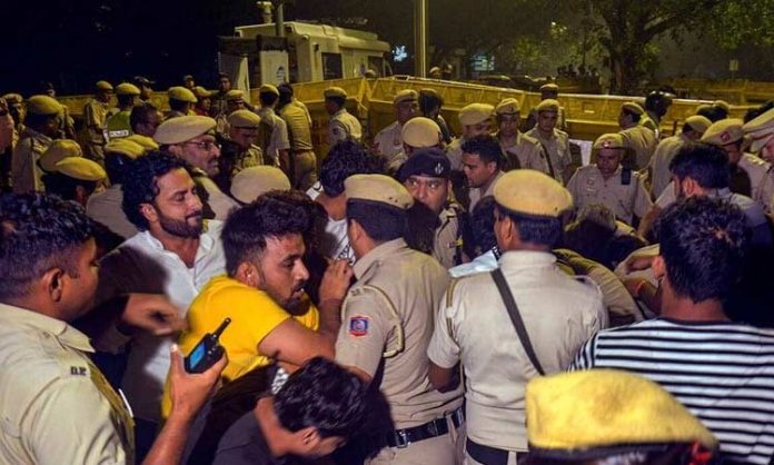 Wrestlers and Police scuffle