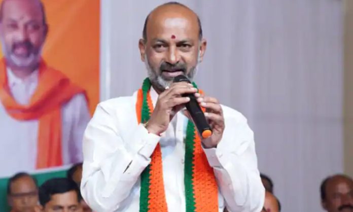 Bandi Sanjay slams BRS and Congress