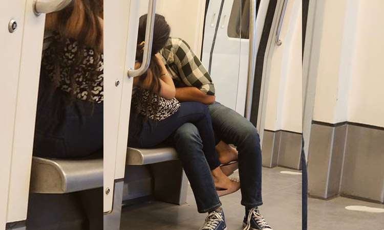 Couple kissing inside Delhi Metro