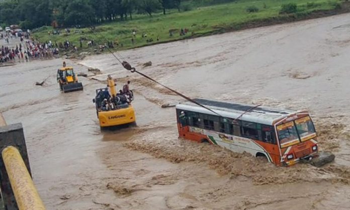 Bus stuck in flood water in UP