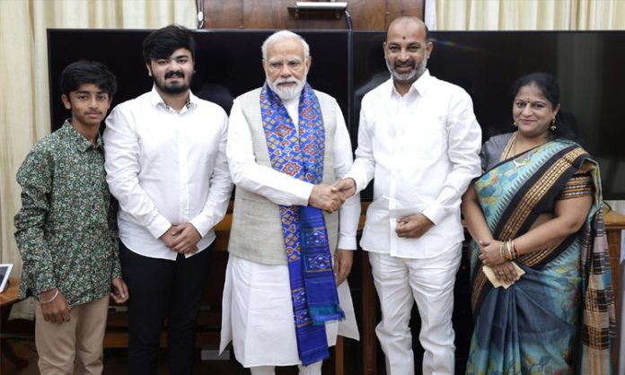 Bandi Sanjay meets Modi with his family