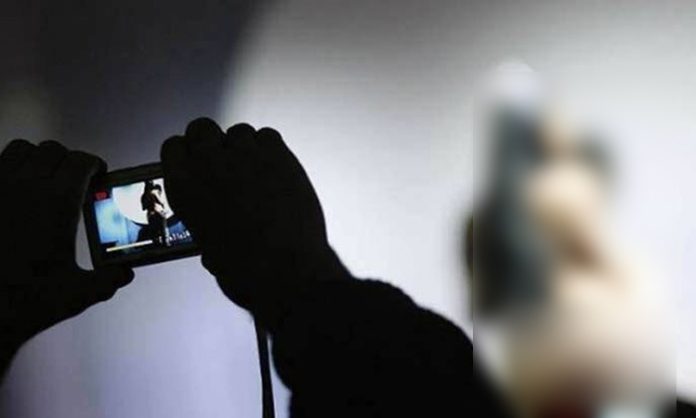 Video recording while young women bathing