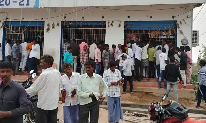 Liquor lovers lined up in front of the wines