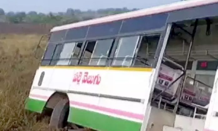 RTC bus rammed into crop fields in Warangal