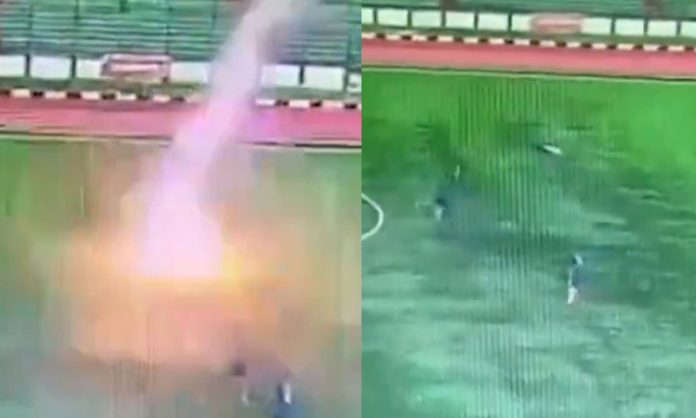 Lightning strikes on player in football field