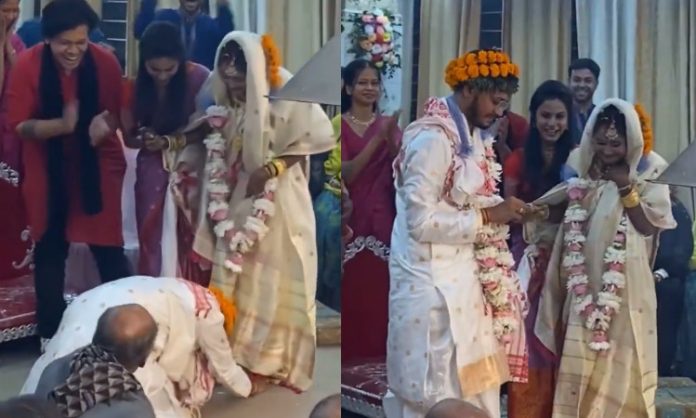 Groom Bowing at Bride's Feet