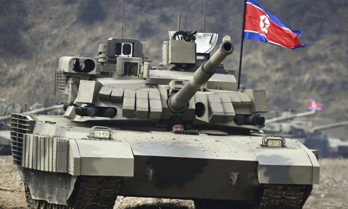 North Korea's Kim Jong Un drives new tank