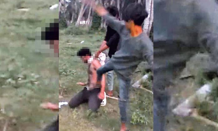 student tied to tree